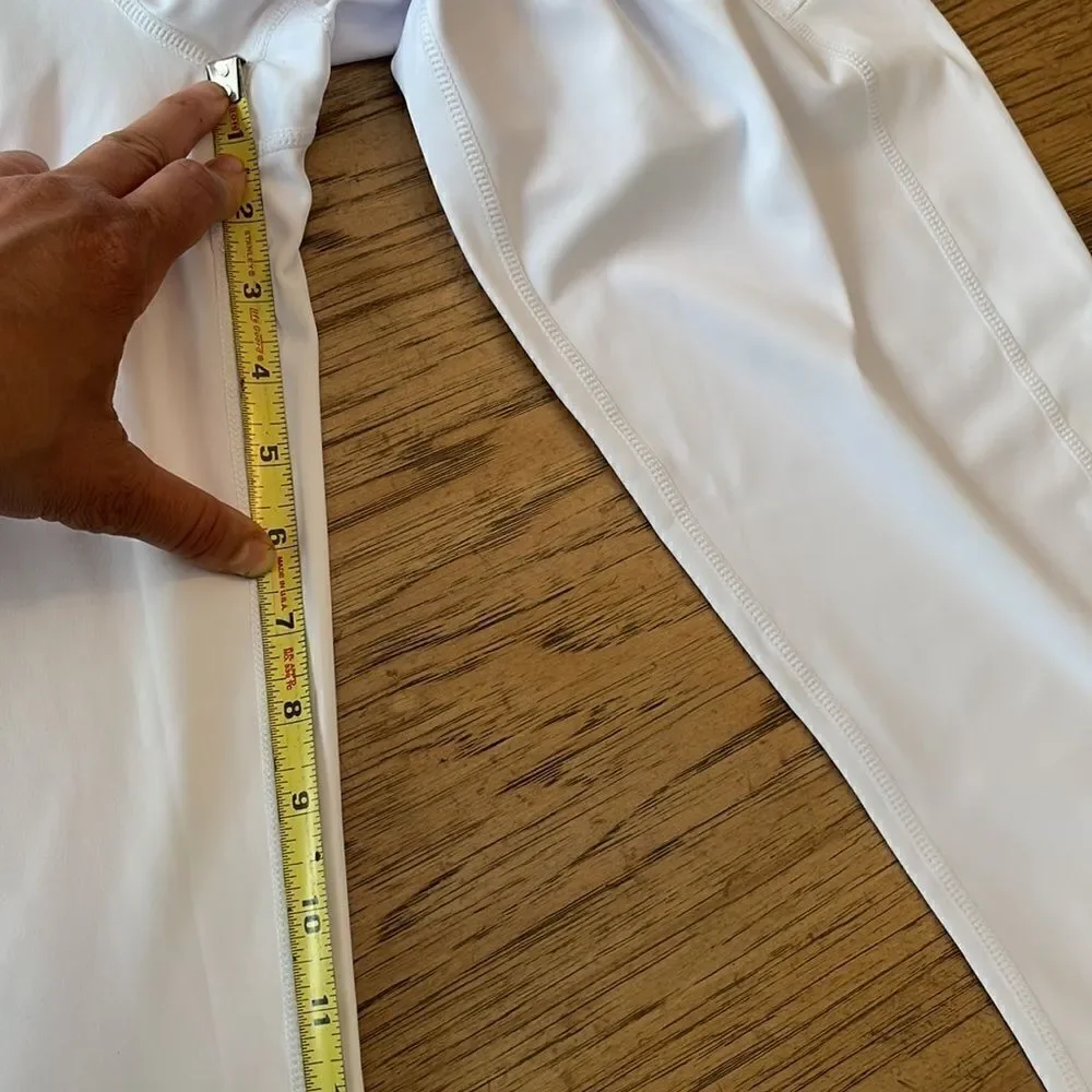Kcutteyg white exercise capris with side pockets.  New with tags